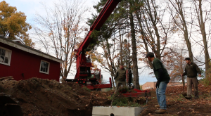 crane truck delivers concrete septic tank in brookfield ct